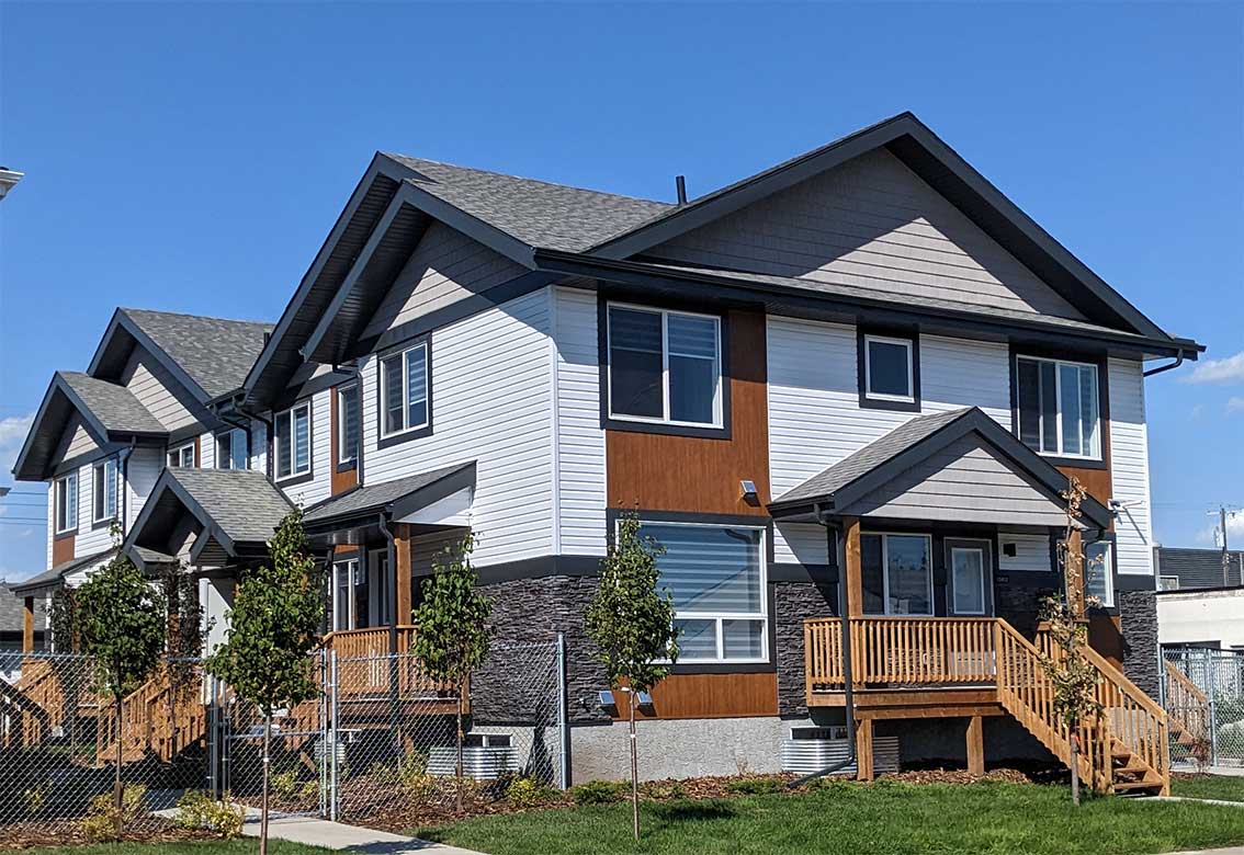 Michael Homes multi-family buildings with front porches and pitched roofs