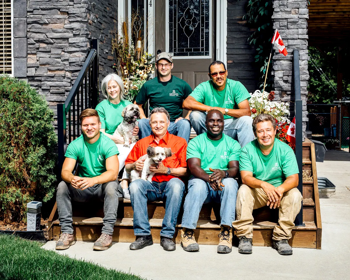 The Michael Homes team on the front steps of a finished home